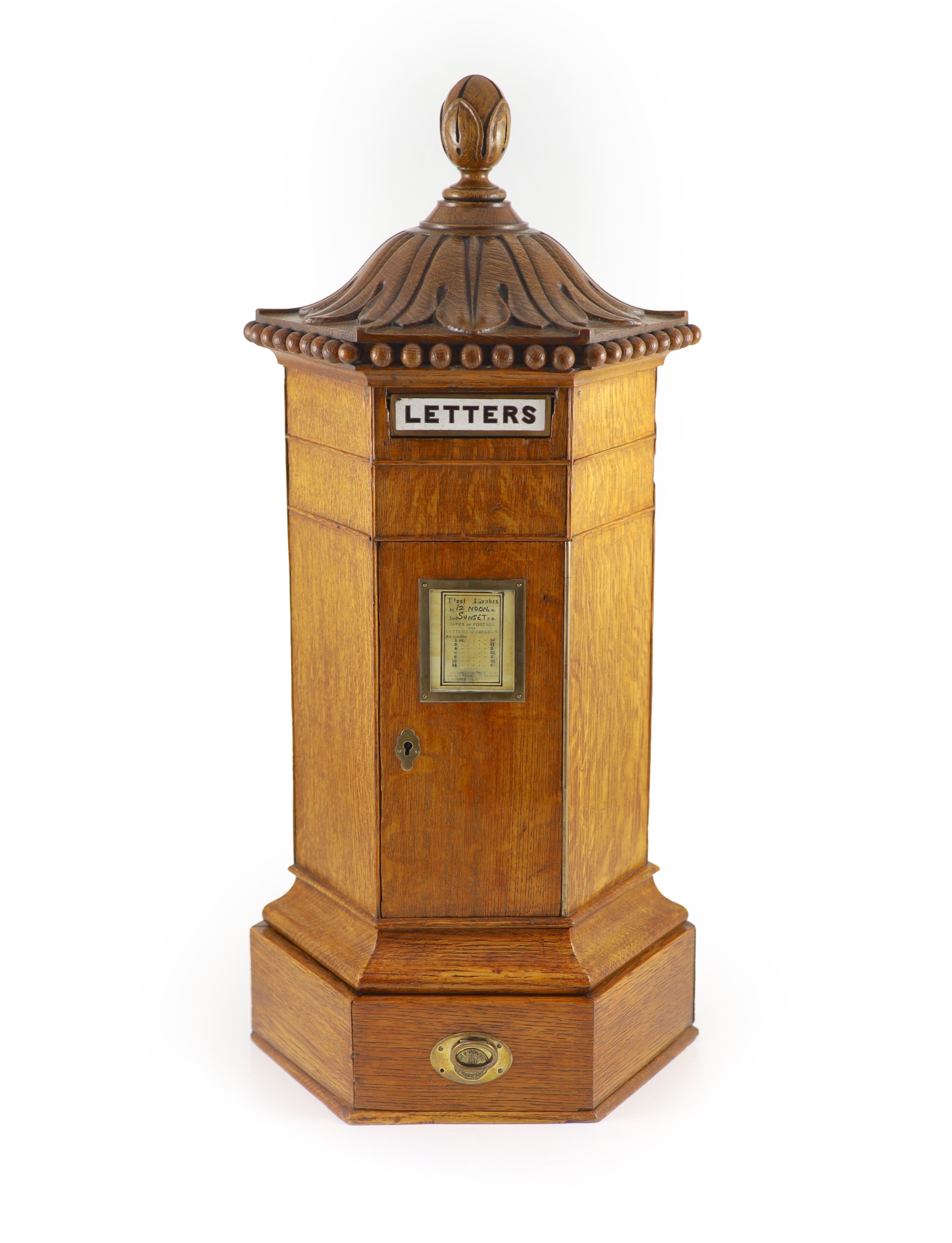 A Victorian oak hexagonal letter box, retailed by Walter Thornhill of 144 New Bond Street H 67cm. W 31cm. D. 26cm.